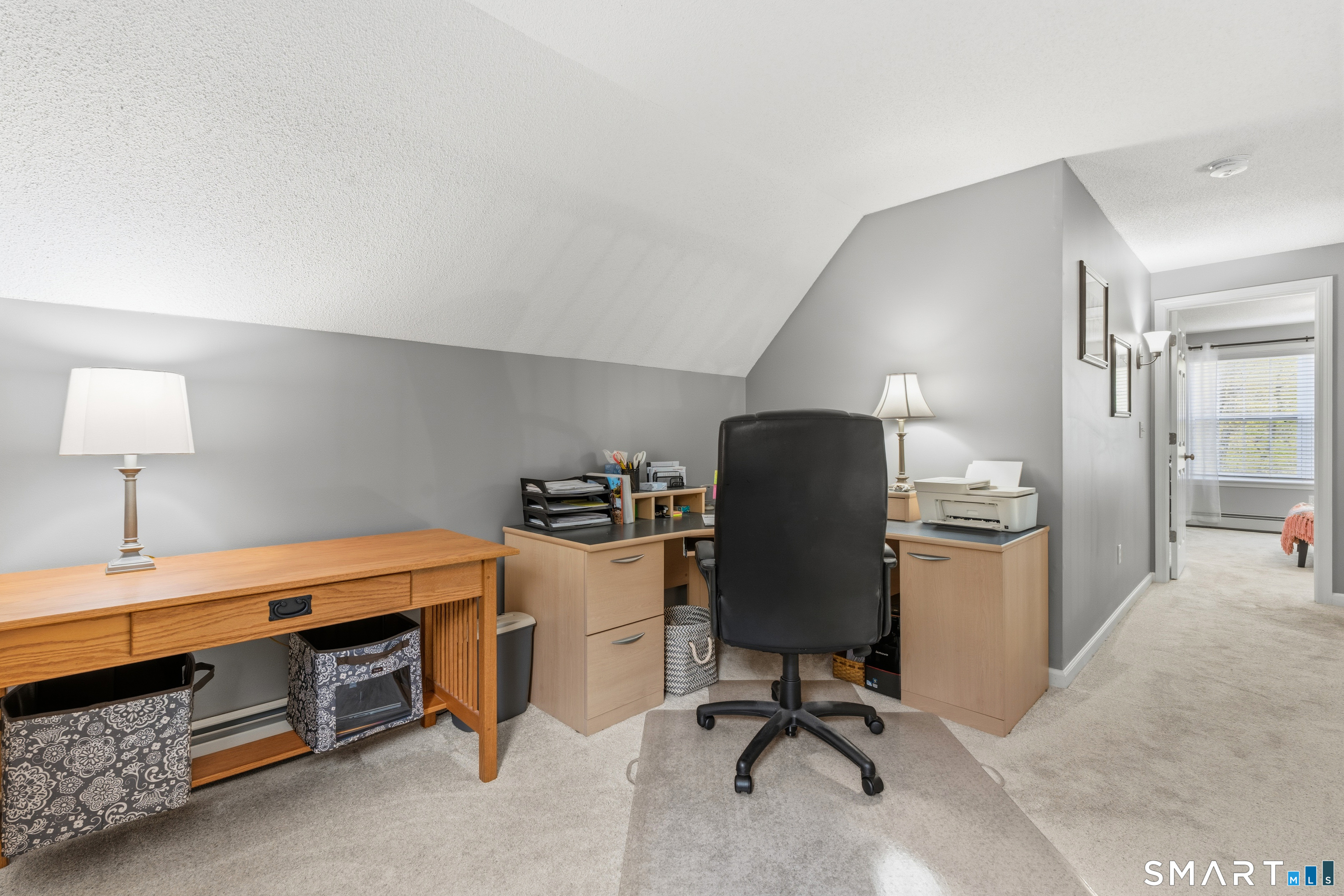 362 Turnpike Road Ashford, CT 06278 - Photo 21 of 40 a view of a workspace with furniture and a lamp