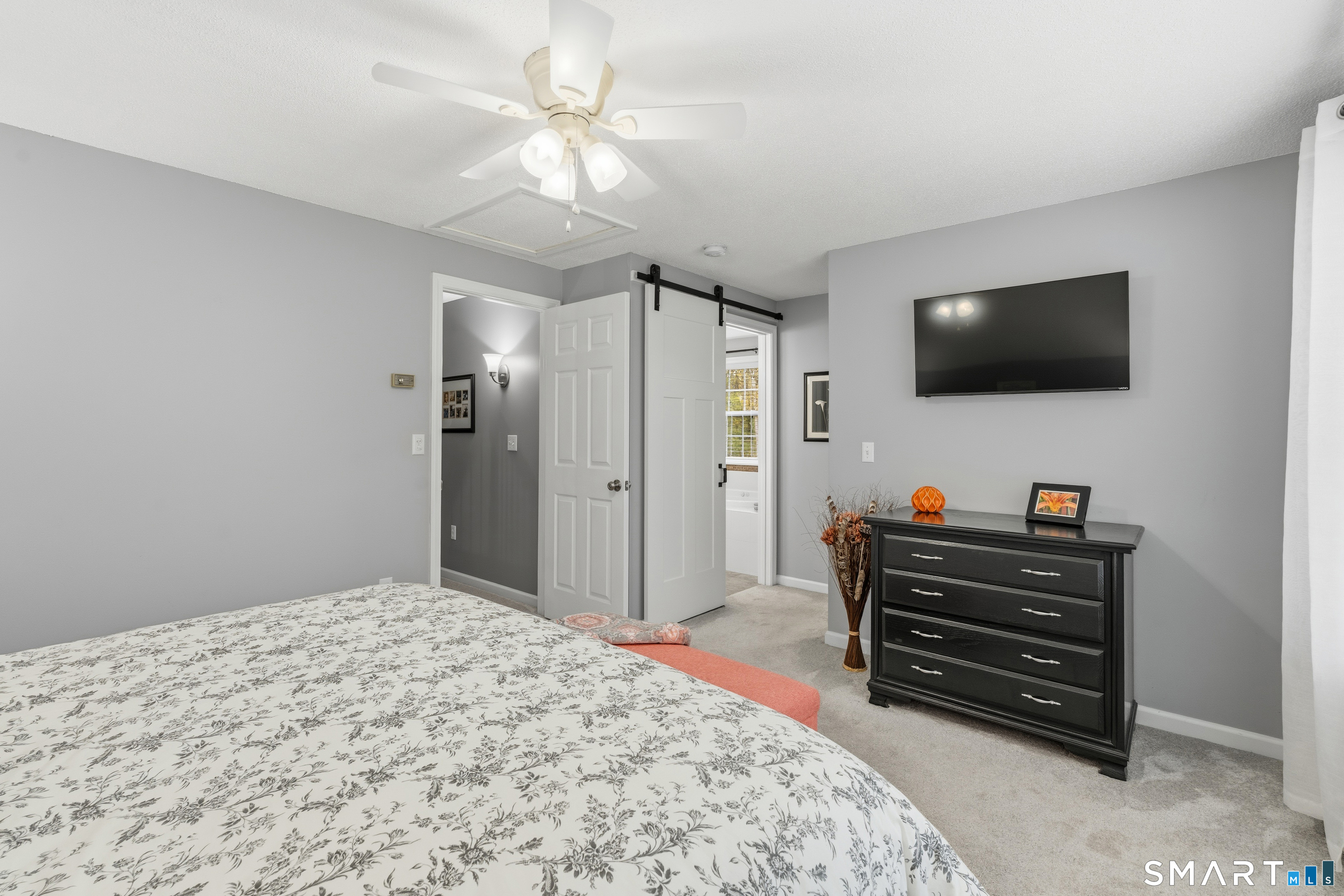 362 Turnpike Road Ashford, CT 06278 - Photo 25 of 40 a bedroom with a bed and a flat screen tv