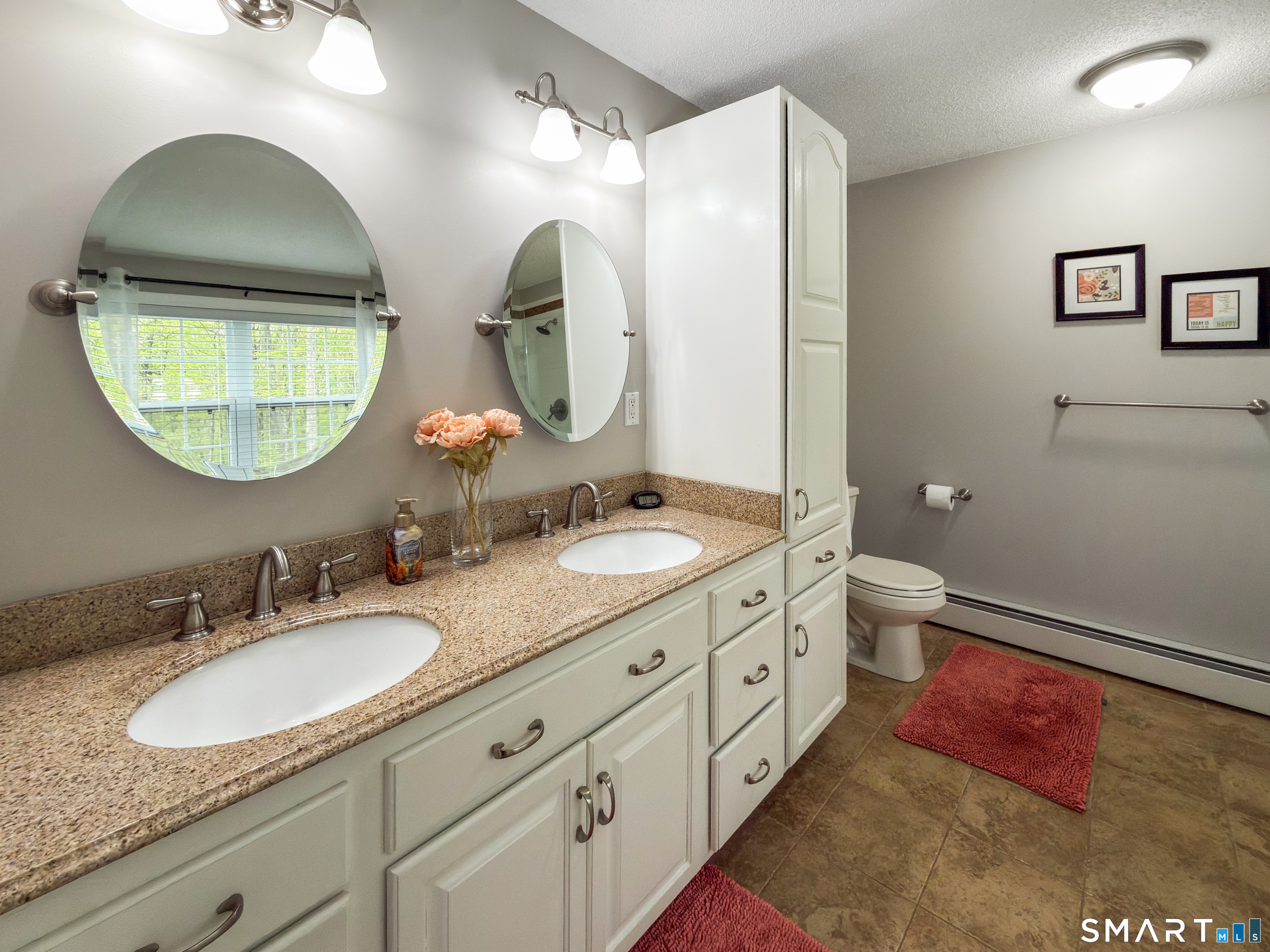 362 Turnpike Road Ashford, CT 06278 - Photo 28 of 40 a bathroom with double vanity sinks and a mirror