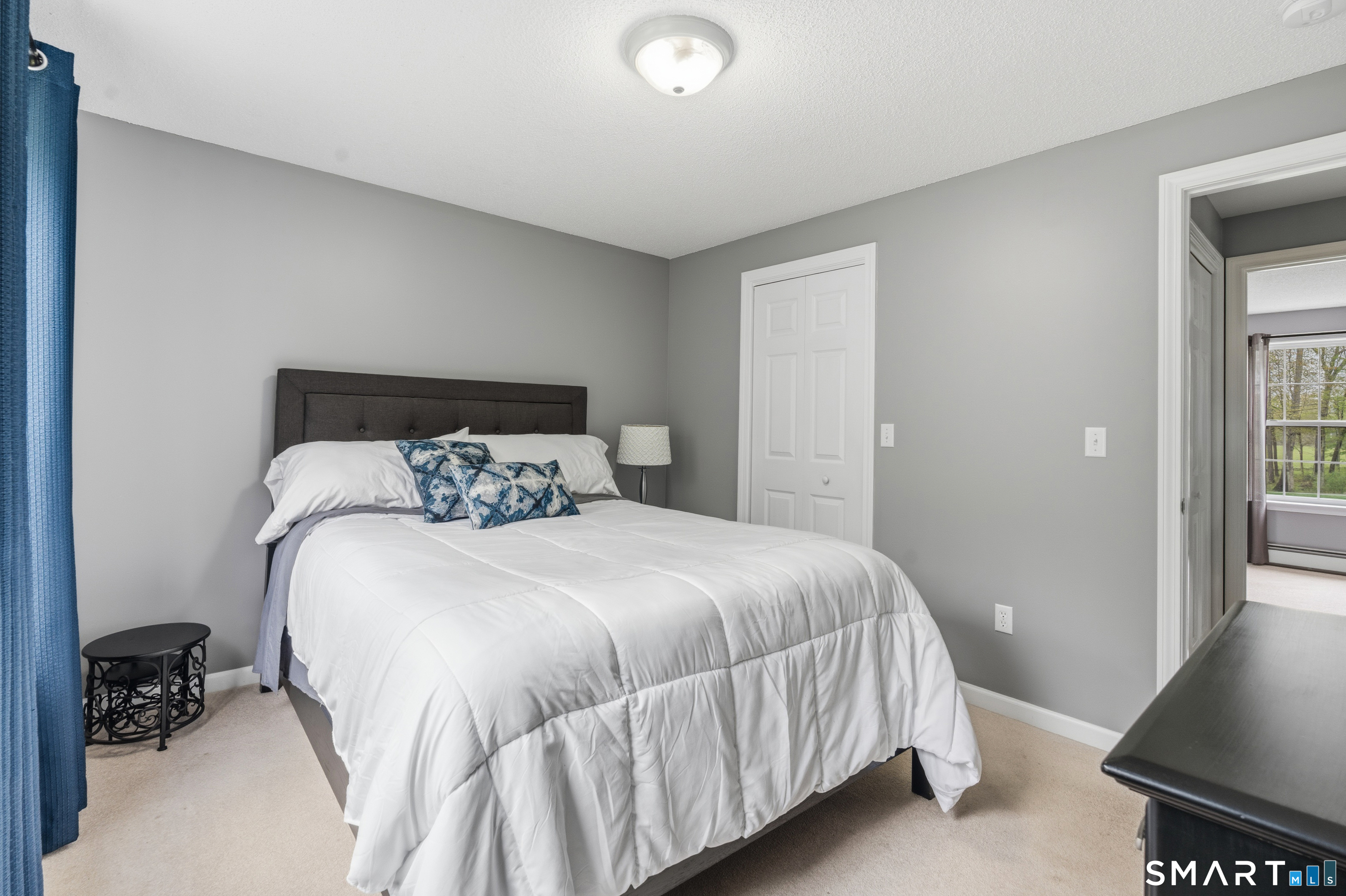 362 Turnpike Road Ashford, CT 06278 - Photo 29 of 40 a bedroom with a bed and a chair