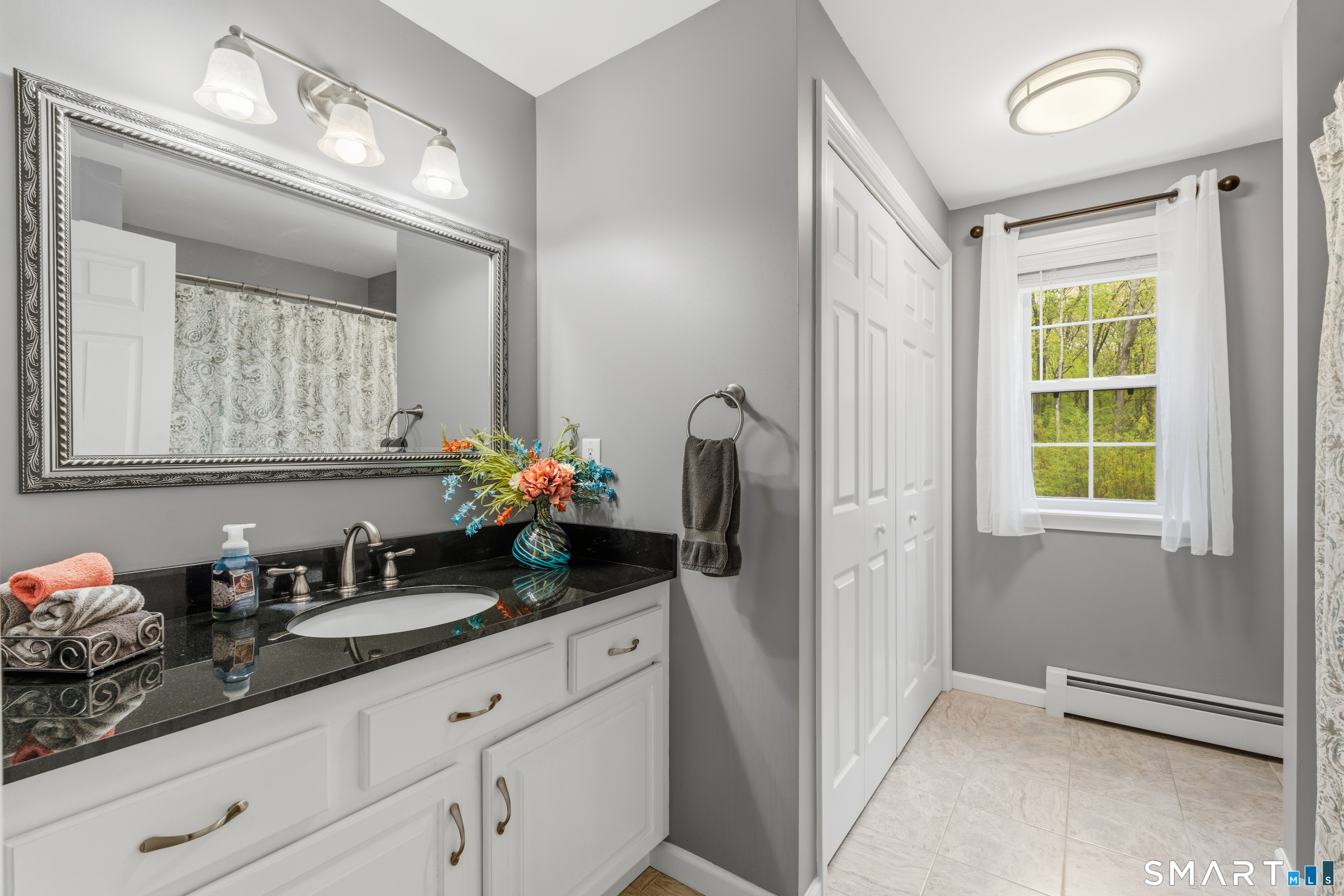 362 Turnpike Road Ashford, CT 06278 - Photo 31 of 40 a bathroom with a granite countertop sink and a mirror