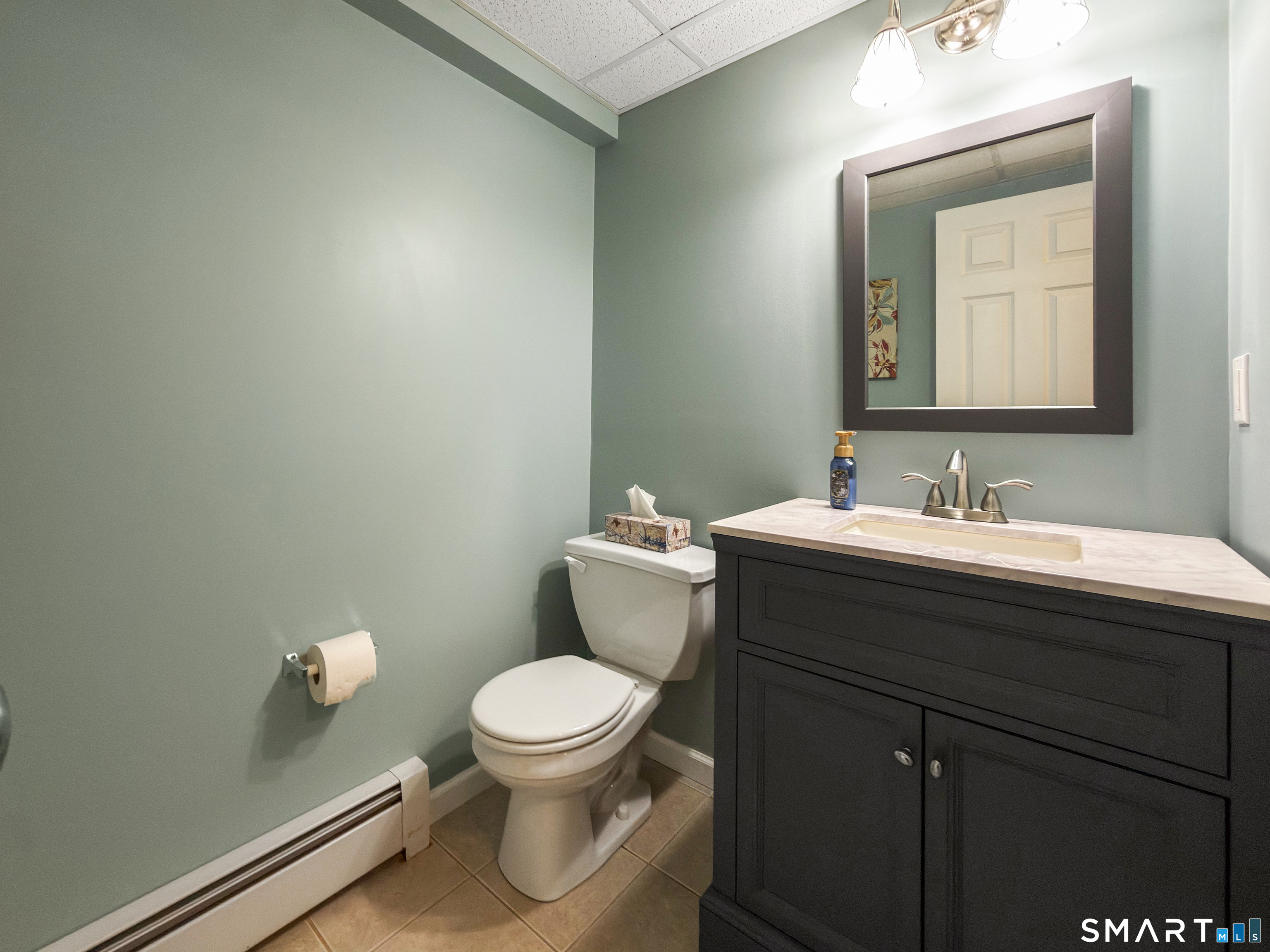 362 Turnpike Road Ashford, CT 06278 - Photo 37 of 40 a bathroom with a sink a toilet and mirror