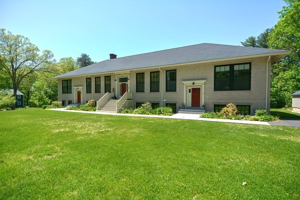 a front view of house with yard and green space