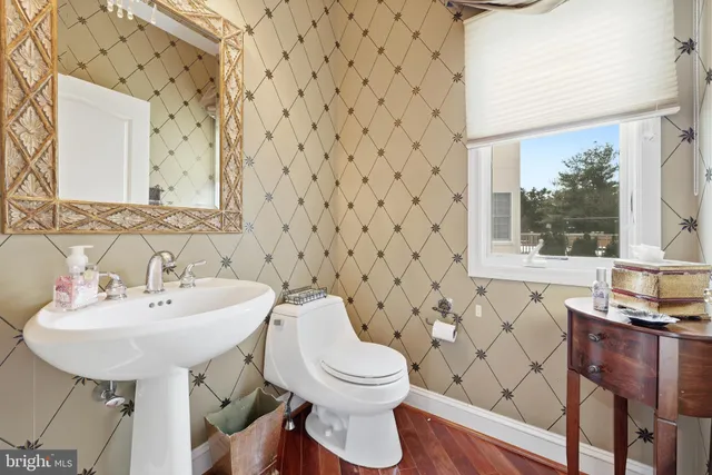 a large spacious bathroom with a double vanity sink a mirror a bathtub and shower