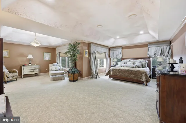 a large spacious bathroom with a large tub and sink