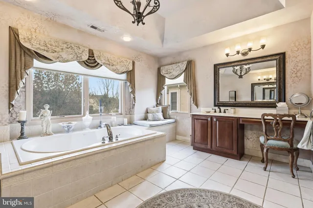 a bedroom with a bed and large window