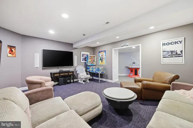 an aerial view of a house with garden space and a car parked in the yard