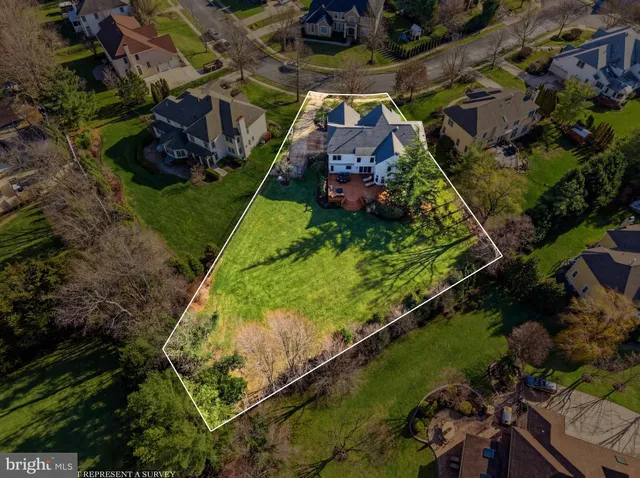 a living room with furniture and a dining table with wooden floor