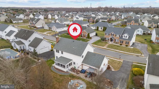an aerial view of a house with a swimming pool