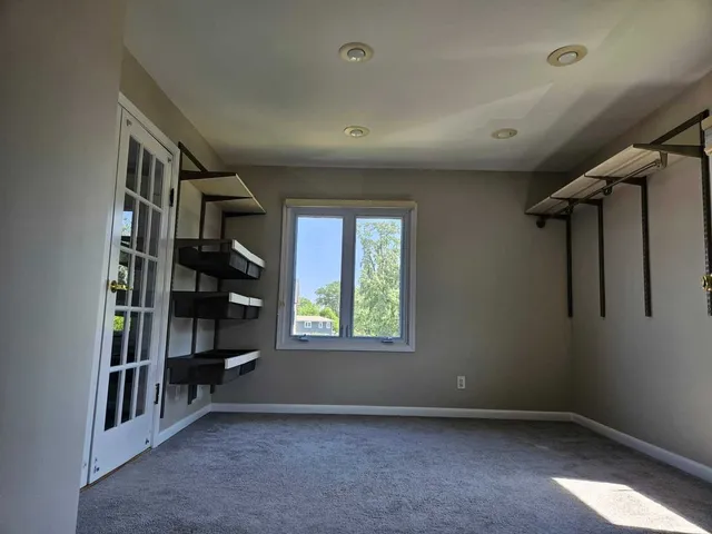 a bedroom with a bed and a table