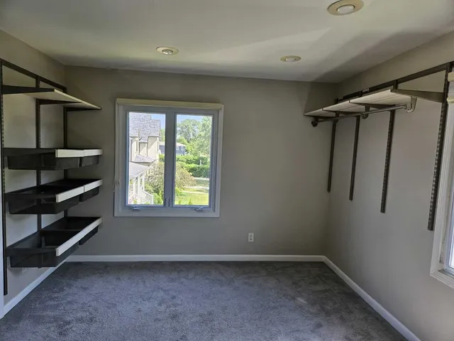 a bedroom with a bed and furniture