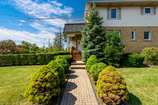 a view of a livingroom with furniture and a window