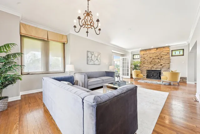 a kitchen with stainless steel appliances granite countertop wooden cabinets a stove top oven a sink and dishwasher