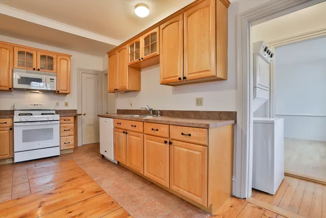 a kitchen with stainless steel appliances granite countertop a stove and a sink