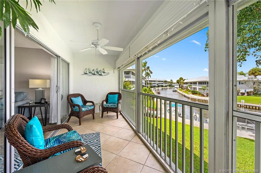 1862 Southwest Palm City Road, Unit 203 Stuart, FL 34994 - Photo 15 of 39 a living room with furniture and a large window