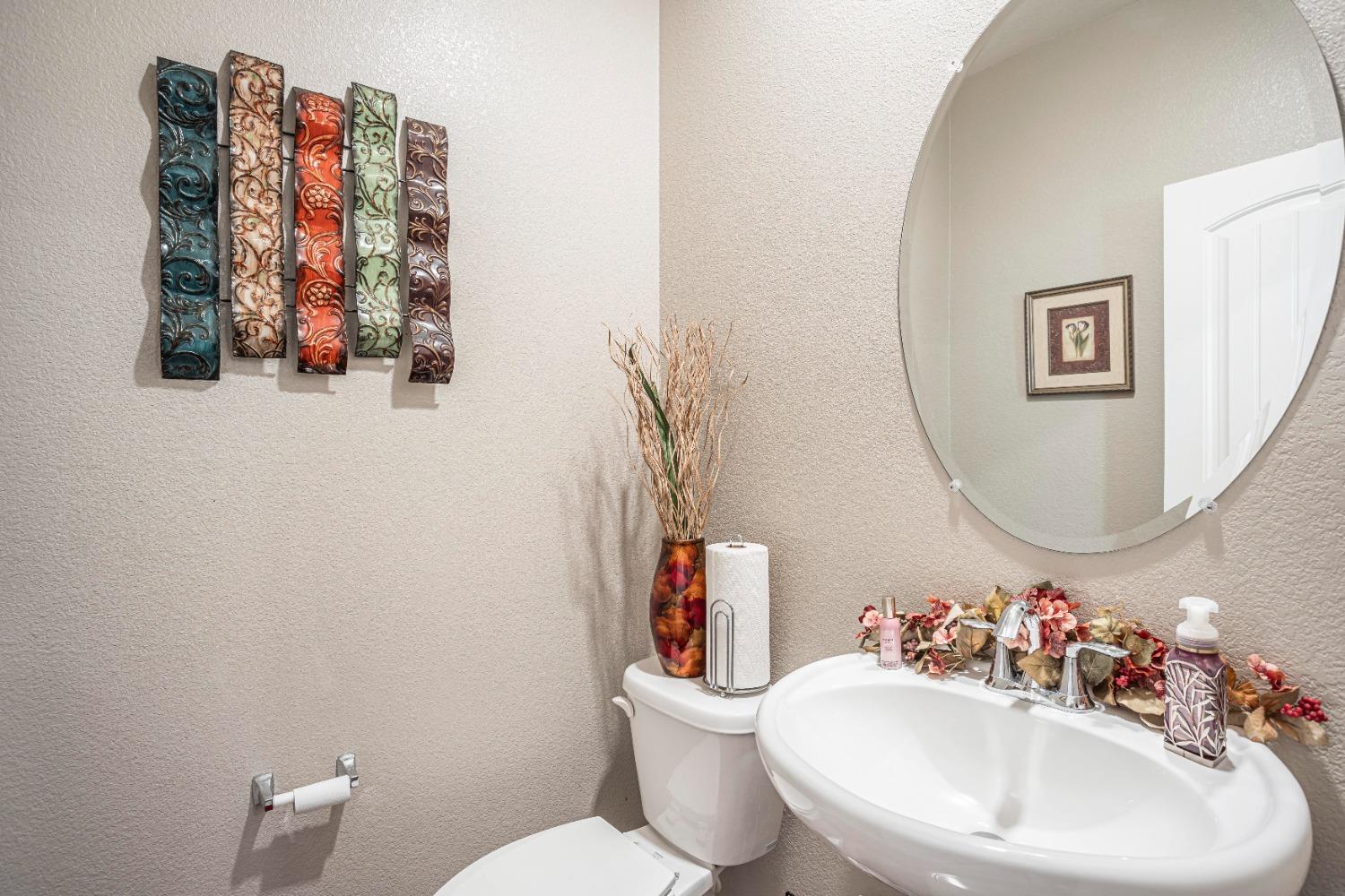 2510 Natomas Crossing Drive Sacramento, CA 95834 - Photo 13 of 34 a bathroom with a toilet sink and mirror
