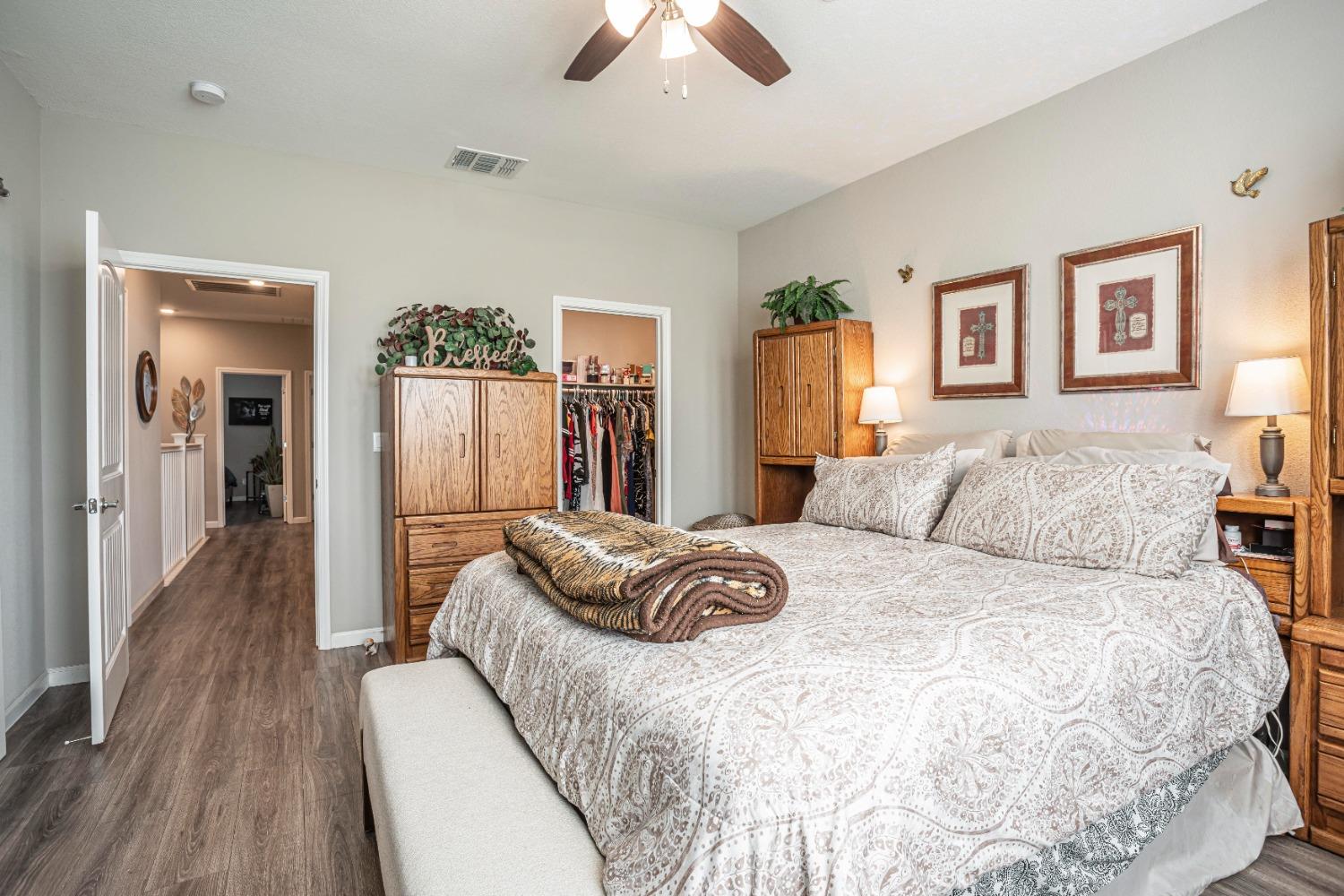 2510 Natomas Crossing Drive Sacramento, CA 95834 - Photo 15 of 34 a bedroom with a bed and wooden floor