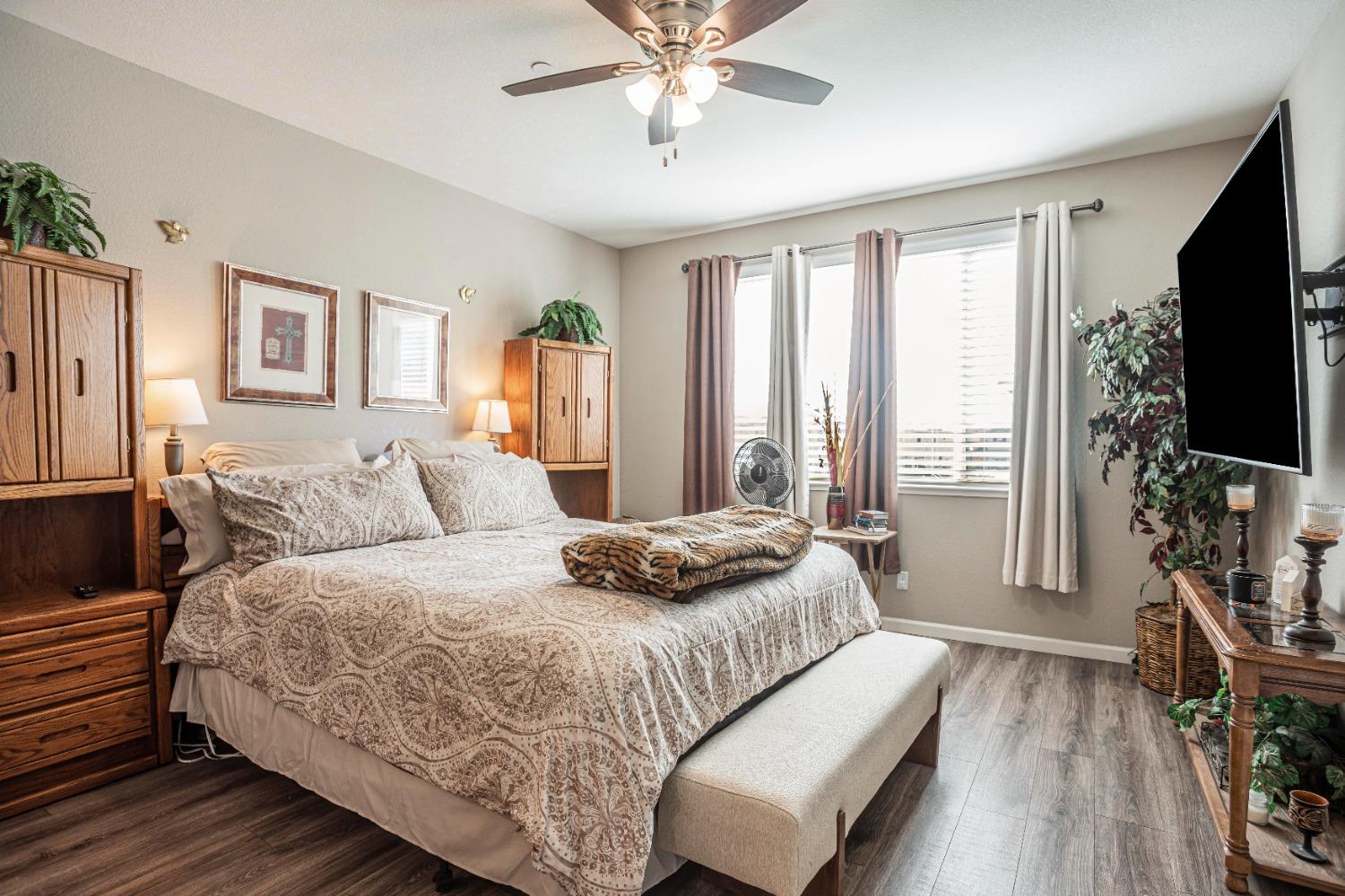 2510 Natomas Crossing Drive Sacramento, CA 95834 - Photo 17 of 34 a bedroom with a bed and a flat screen tv