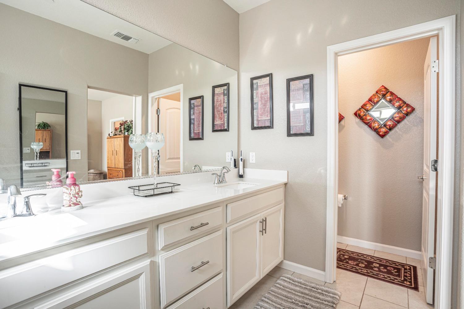 2510 Natomas Crossing Drive Sacramento, CA 95834 - Photo 19 of 34 a bathroom with a sink and a mirror