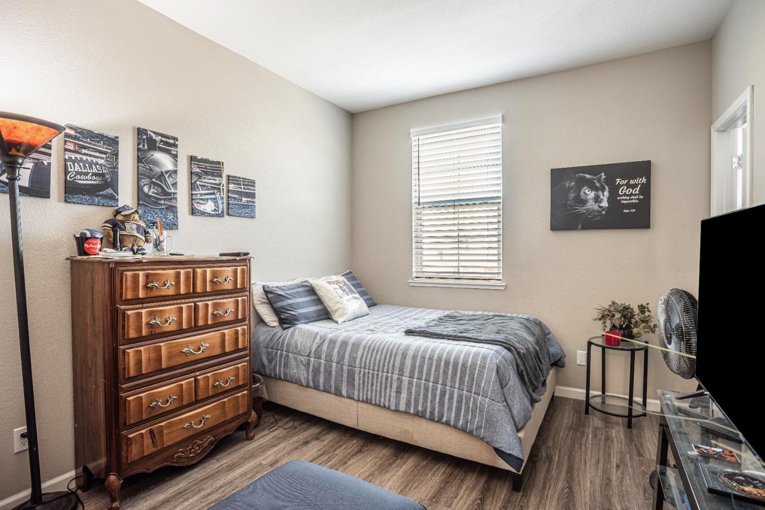 2510 Natomas Crossing Drive Sacramento, CA 95834 - Photo 23 of 34 a bedroom with a bed and a flat screen tv