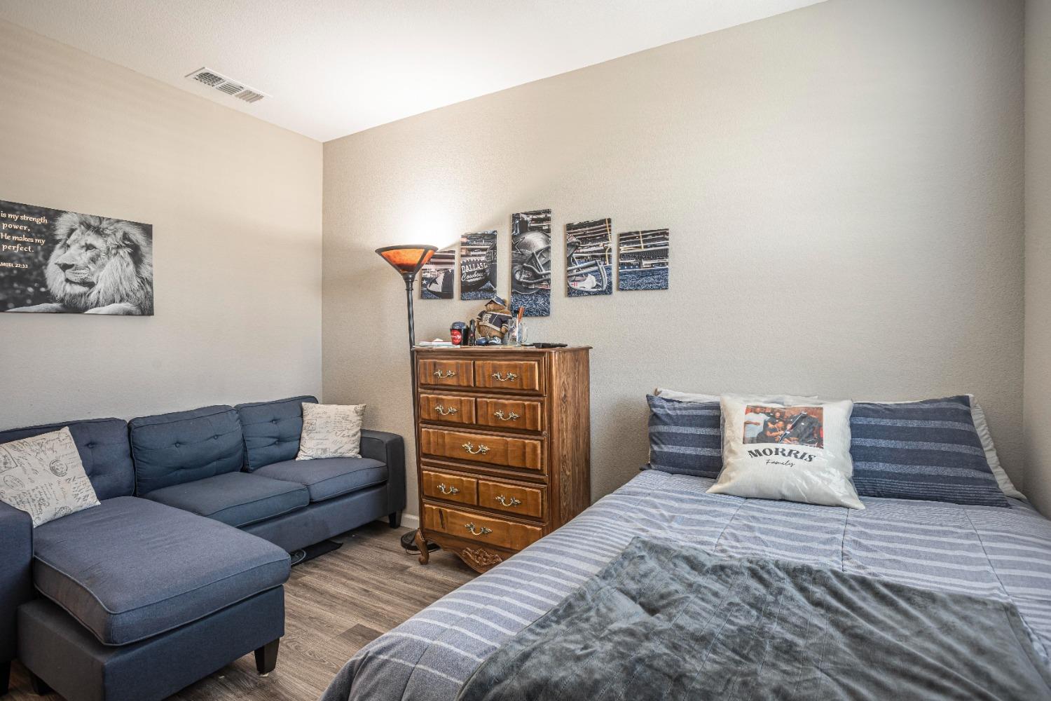 2510 Natomas Crossing Drive Sacramento, CA 95834 - Photo 24 of 34 a bedroom with a bed and couch