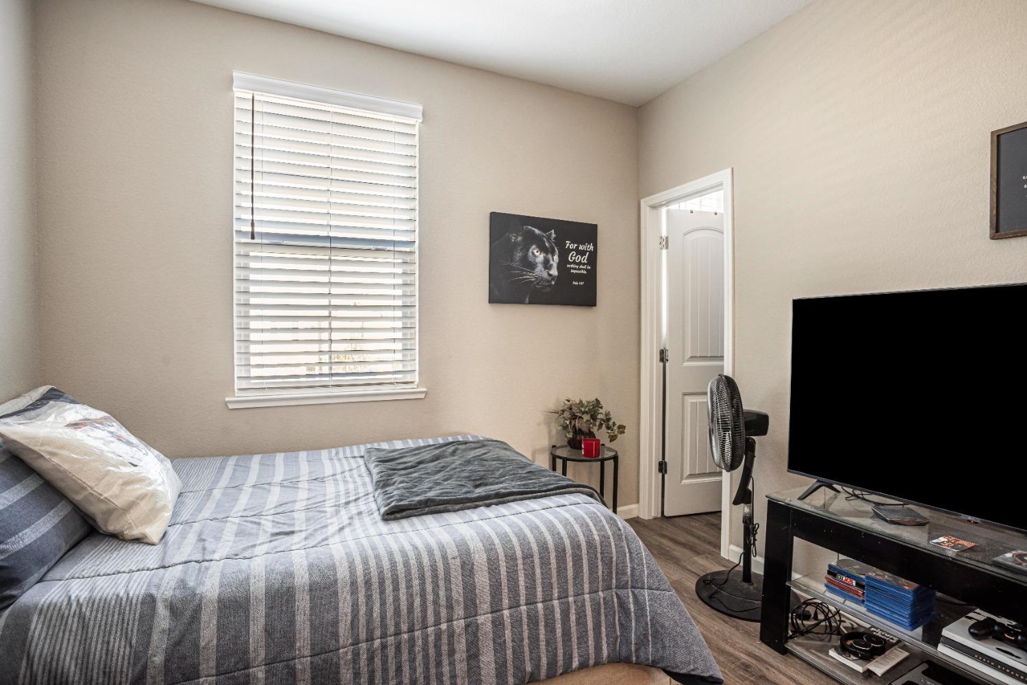 2510 Natomas Crossing Drive Sacramento, CA 95834 - Photo 25 of 34 a bedroom with a bed and a flat screen tv