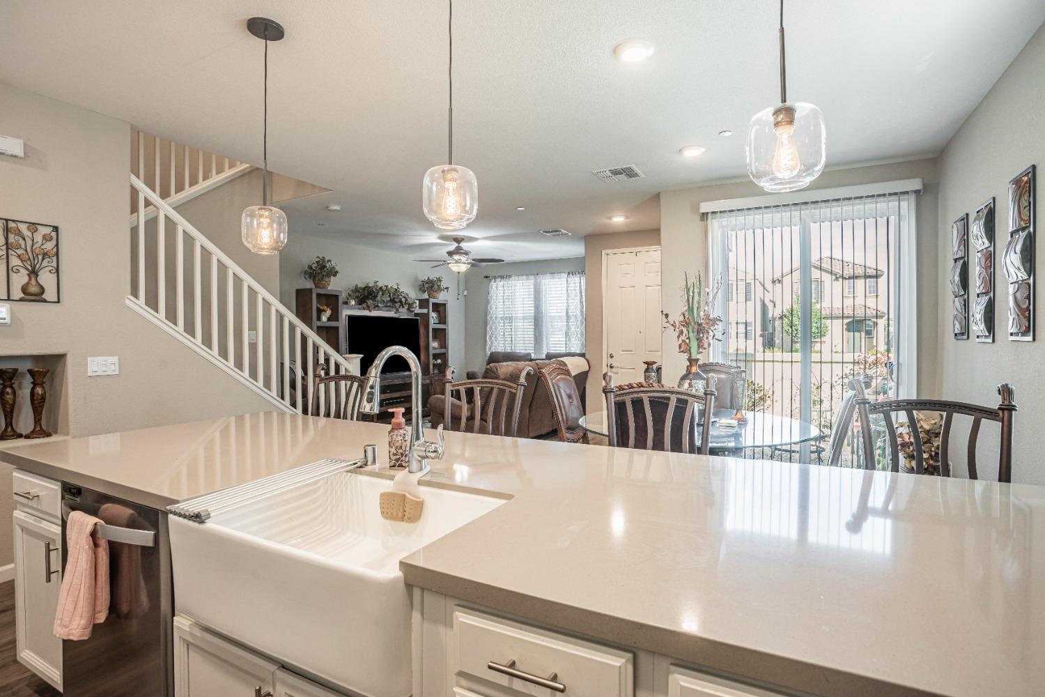 2510 Natomas Crossing Drive Sacramento, CA 95834 - Photo 8 of 34 a view of a dining room and hall with a chandelier