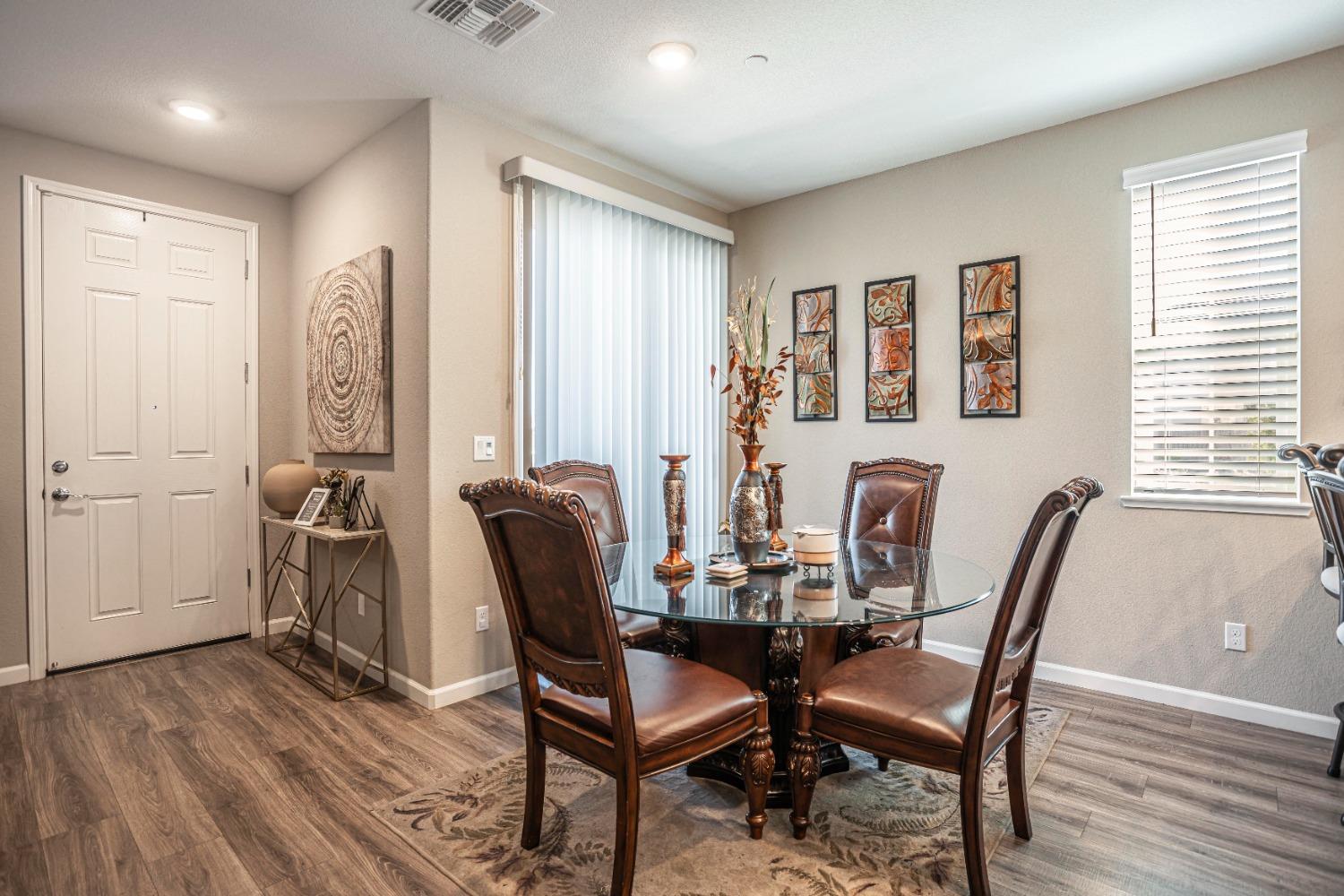 2510 Natomas Crossing Drive Sacramento, CA 95834 - Photo 10 of 34 a view of a a dining room with furniture window and wooden floor
