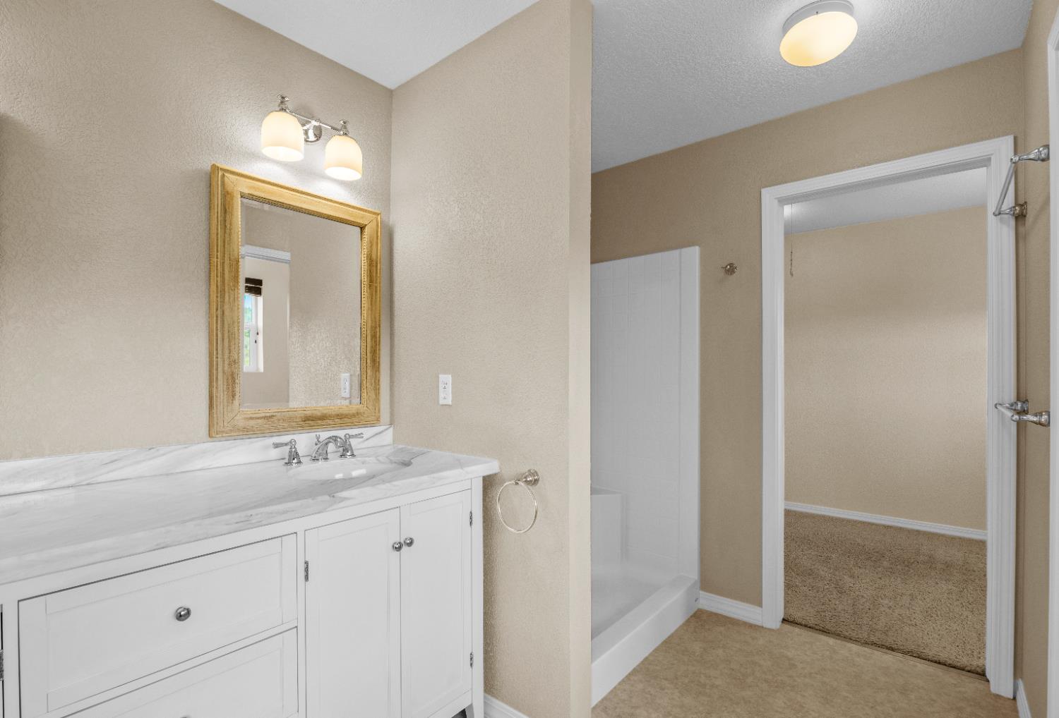 18450 Sugar Loaf Road Jackson, CA 95642 - Photo 23 of 58 primary bathroom leading into walk in closet