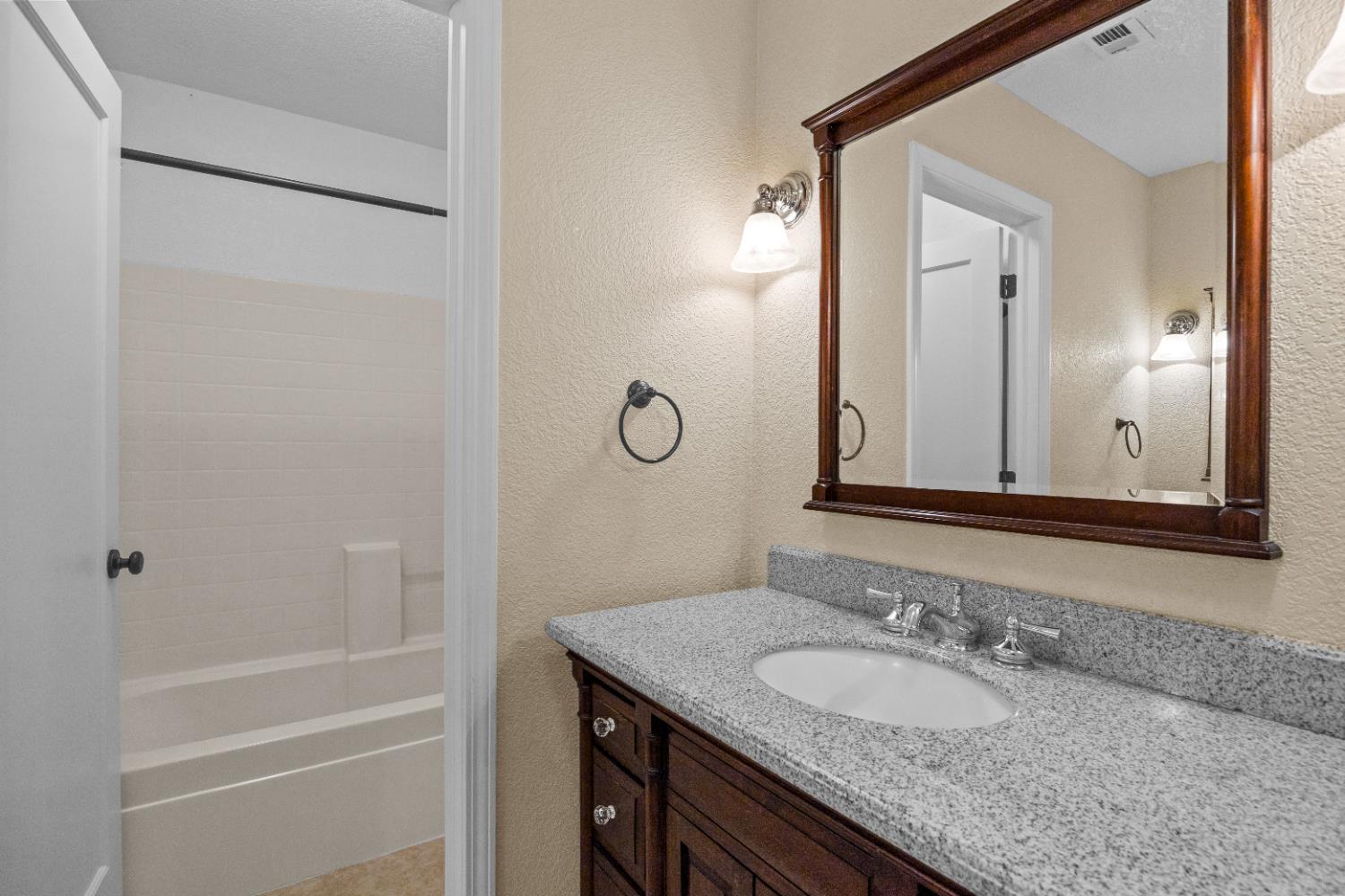 18450 Sugar Loaf Road Jackson, CA 95642 - Photo 28 of 58 second story full bathroom with dual vanities