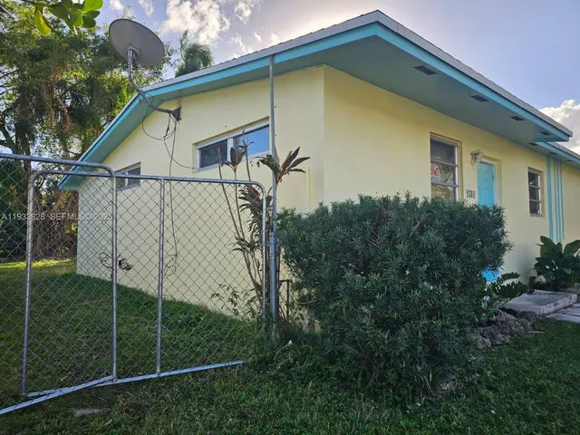 a house with trees in front of it