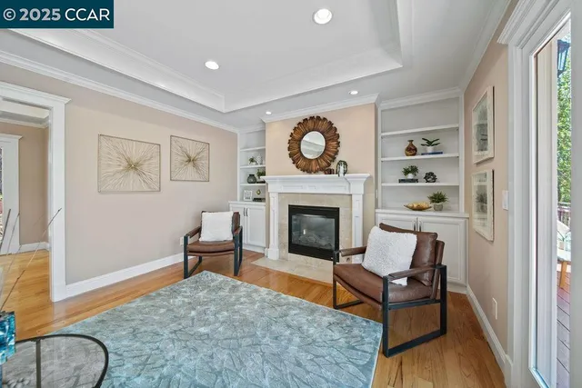 a kitchen with a stove a sink a center island and wooden floor