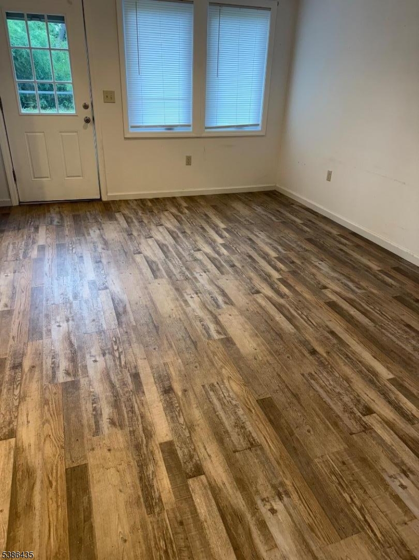 35 Grove Street, Unit B Wanaque, NJ 07465 - Photo 3 of 10 a view of a room with wooden floor and window