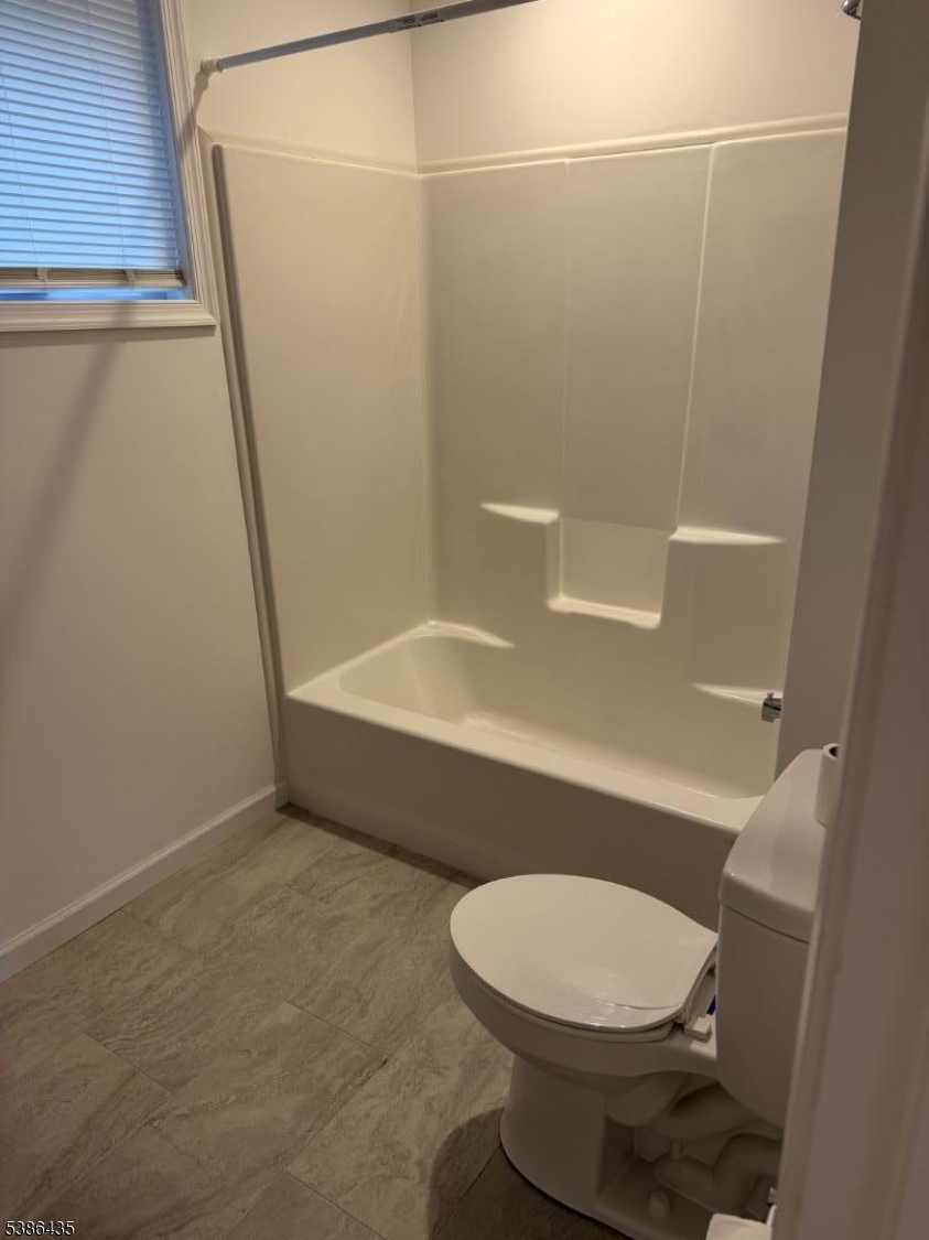 35 Grove Street, Unit B Wanaque, NJ 07465 - Photo 7 of 10 a bathroom with a toilet and a shower