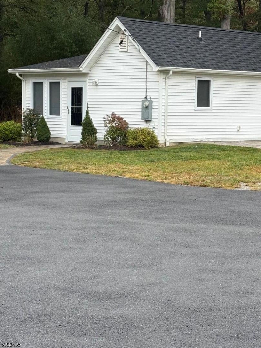 35 Grove Street, Unit B Wanaque, NJ 07465 - Photo 10 of 10 a view of a house with a yard