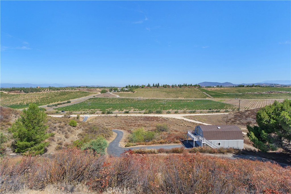 34881 Los Nogales Road Temecula, CA 92592 - Photo 43 of 50 View from above the house looking down to the permited barn/workshop with a loft and skylights!