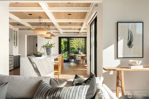 a kitchen with stainless steel appliances granite countertop sink stove and large window
