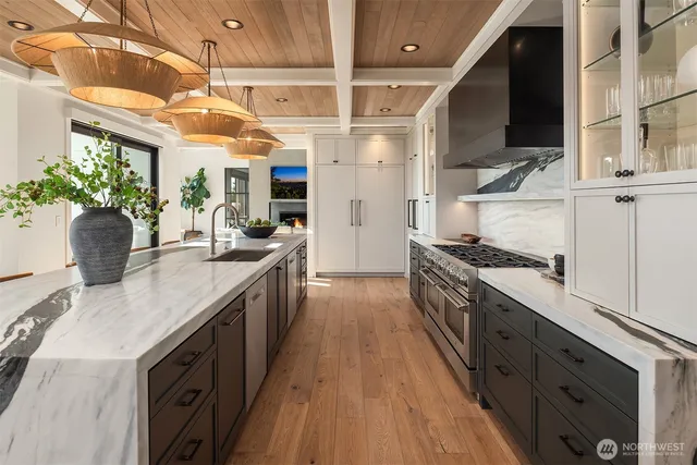 a kitchen with granite countertop a refrigerator and a stove