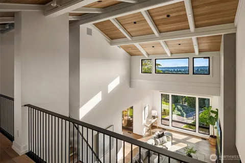 a bed room with a bed and a large window