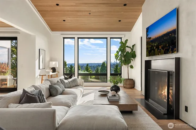 a living room filled with furniture and a large window