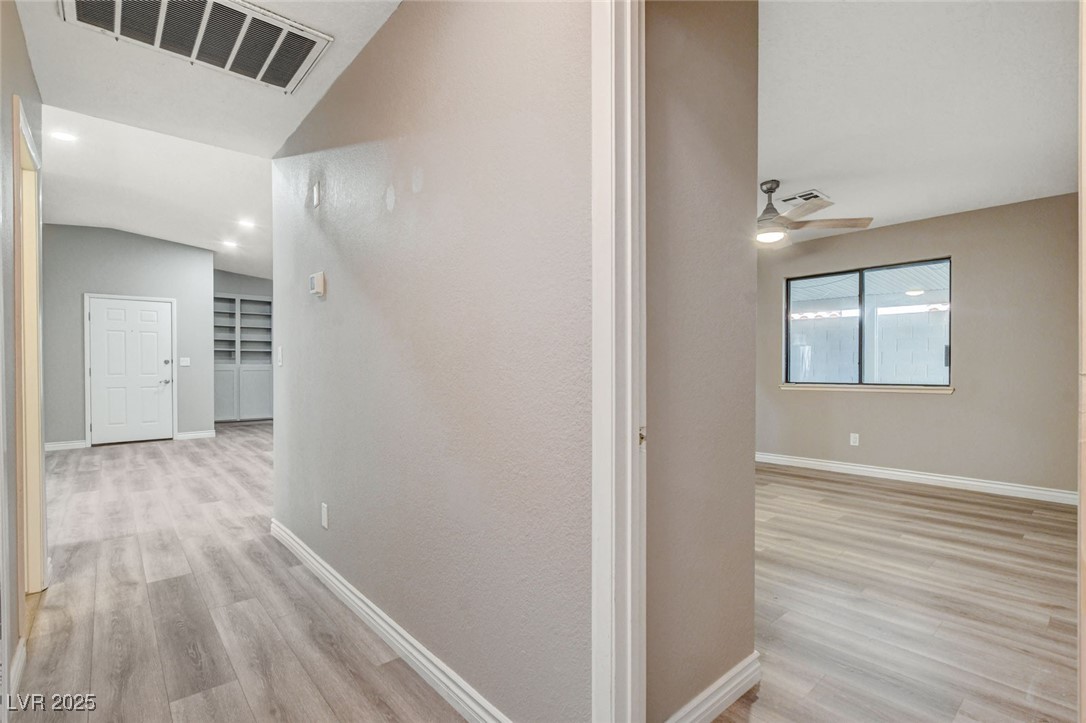 1118 Olmo Way Boulder City, NV 89005 - Photo 12 of 45 Hallway with light wood-style flooring