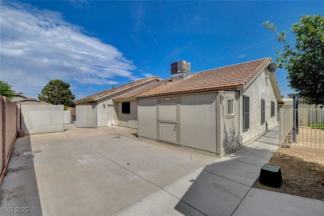 1118 Olmo Way Boulder City, NV 89005 - Photo 32 of 45 Back of house featuring a tiled roof