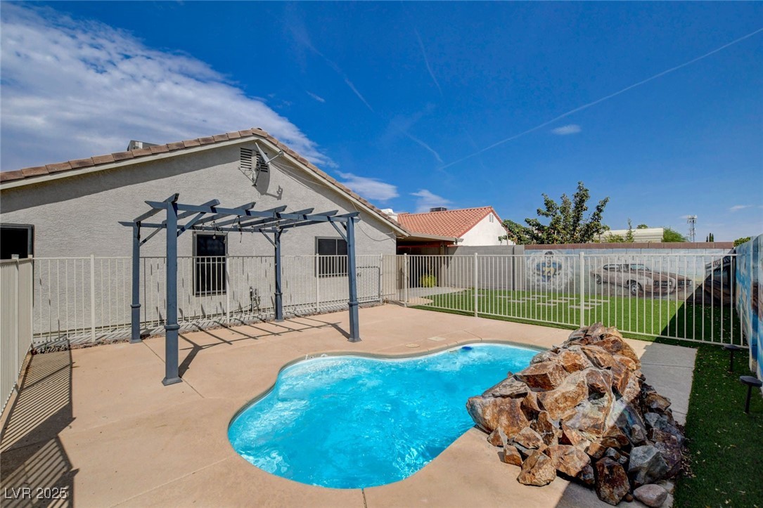 1118 Olmo Way Boulder City, NV 89005 - Photo 37 of 45 View of pool with a patio area and a pergola