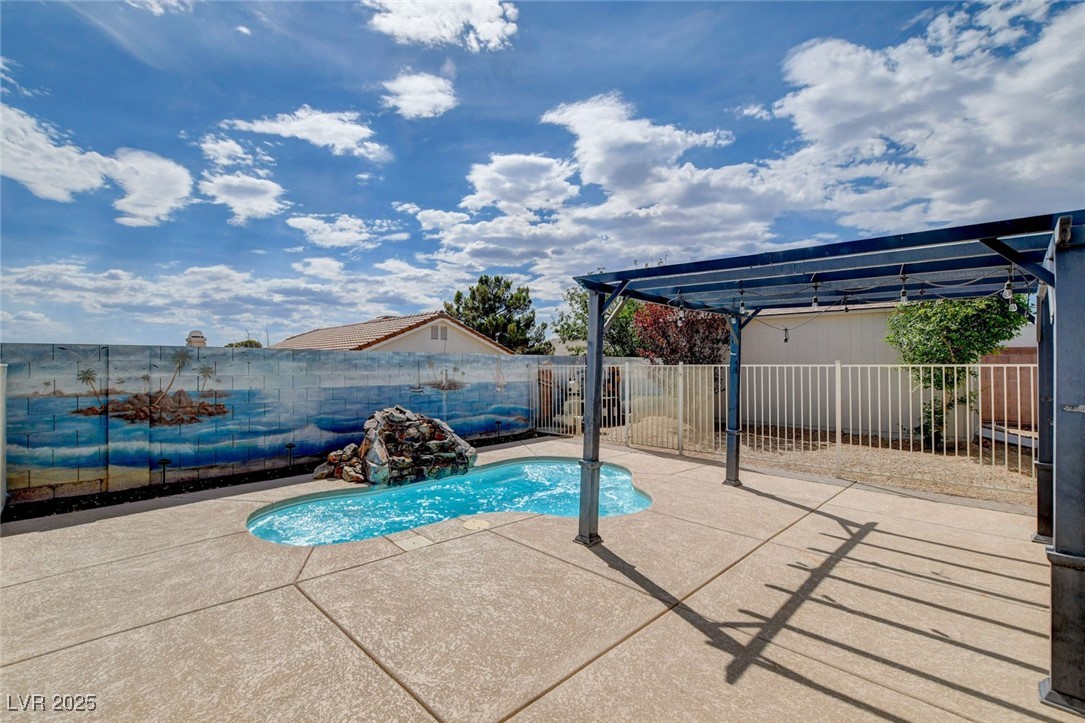 1118 Olmo Way Boulder City, NV 89005 - Photo 38 of 45 View of swimming pool featuring a fenced backyard, a patio area, and a pergola
