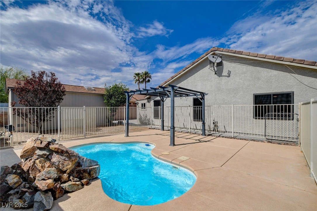 1118 Olmo Way Boulder City, NV 89005 - Photo 39 of 45 View of pool featuring a patio area and a pergola