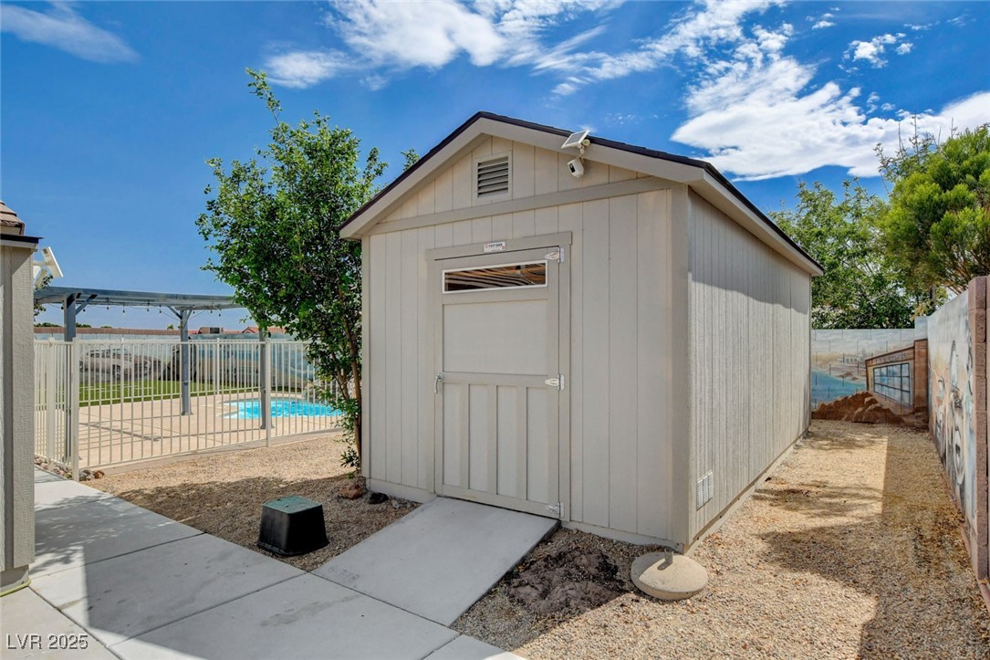 1118 Olmo Way Boulder City, NV 89005 - Photo 41 of 45 View of shed with a fenced backyard