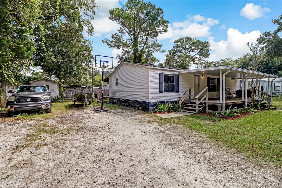 86064 Jones Road Yulee, FL 32097 - Photo 2 of 25 a view of a house with backyard