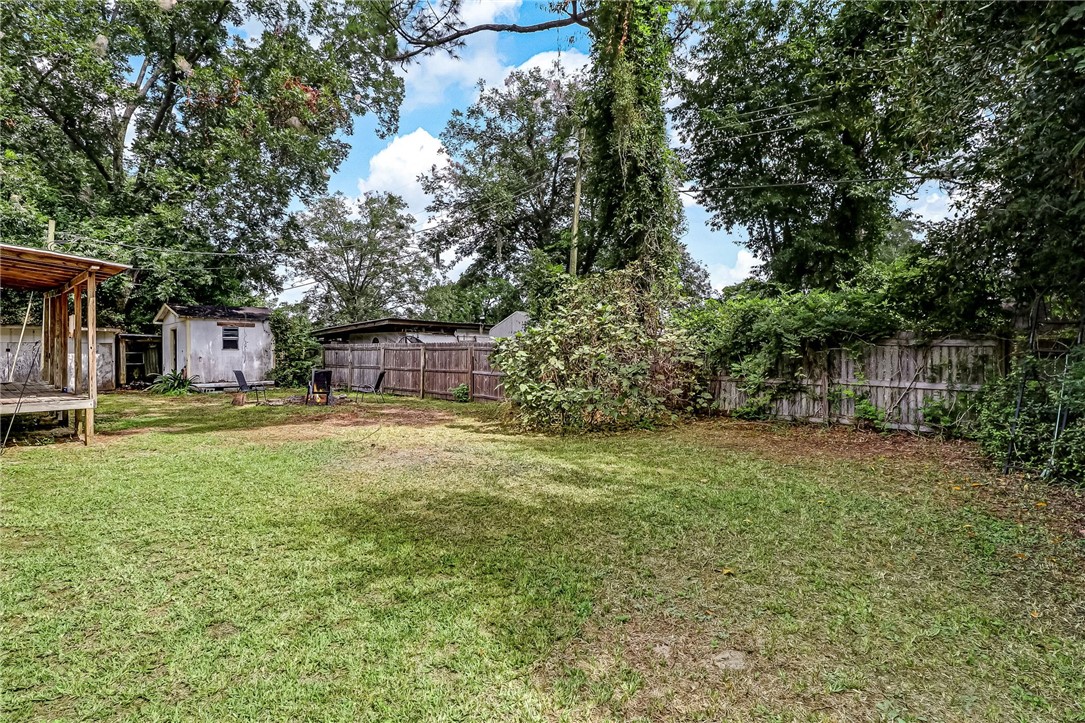 86064 Jones Road Yulee, FL 32097 - Photo 24 of 25 a backyard of a house with lots of green space