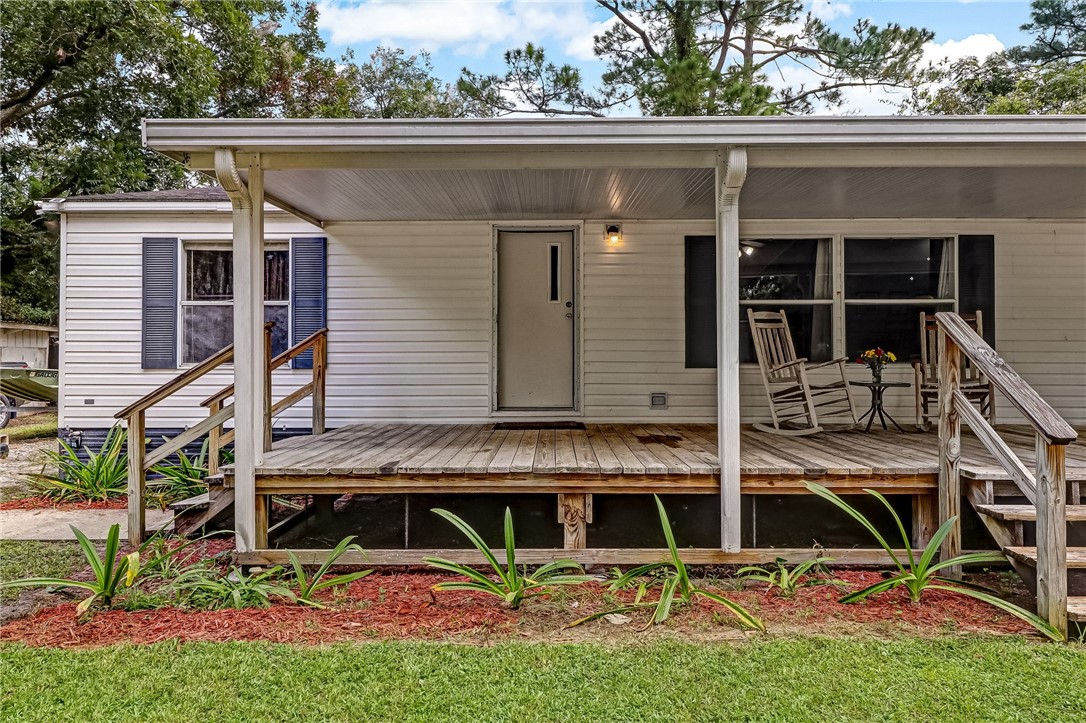 86064 Jones Road Yulee, FL 32097 - Photo 3 of 25 an aerial view of a house with garden
