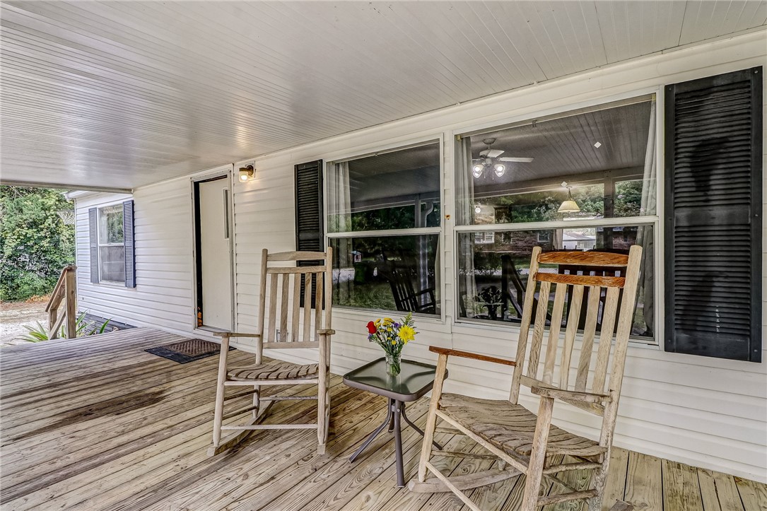 86064 Jones Road Yulee, FL 32097 - Photo 4 of 25 a view of a dinning room with wooden floor and outdoor space
